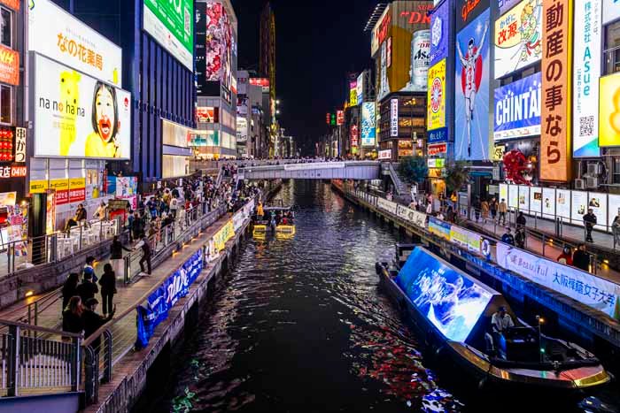 dotonbori canal at night with illuminated billboards